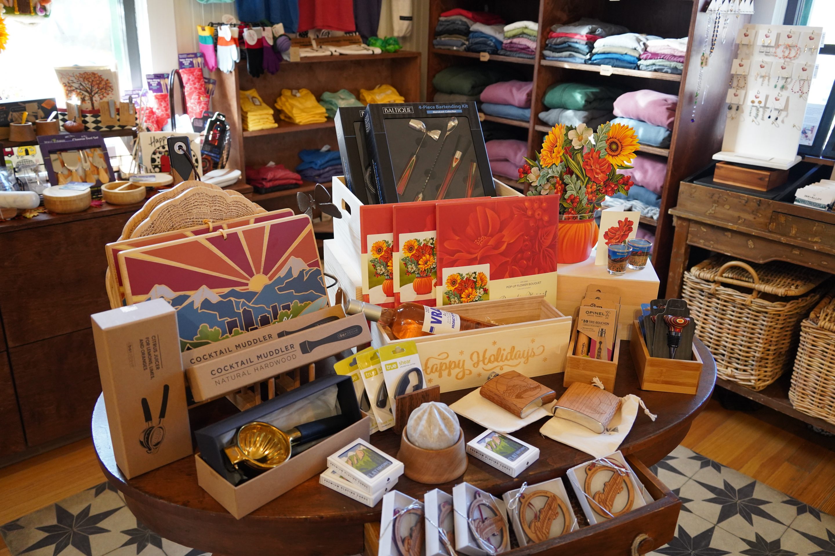 Chautauqua branded coffee mugs hanging up in the General Store