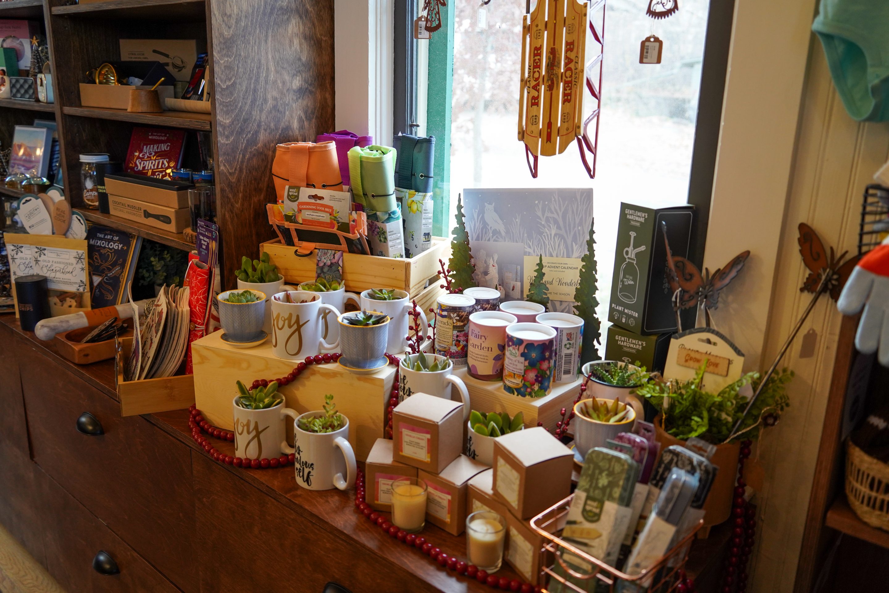 Chautauqua branded coffee mugs hanging up in the General Store